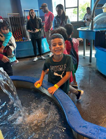 little boy playing in water