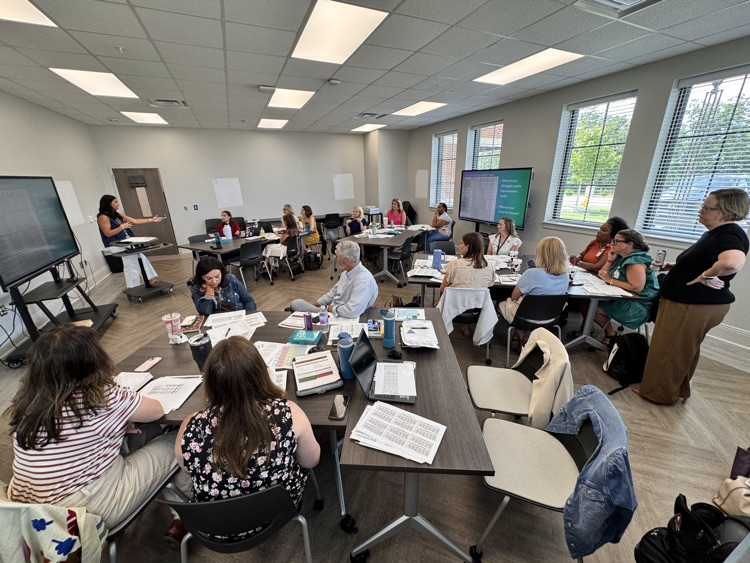 Wide angle of people engaging in professional development