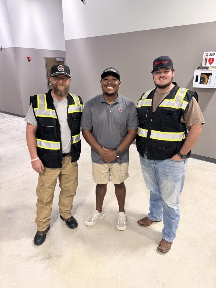 Three men standing