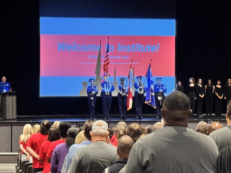Wide angle of audience with JROTC honor guar