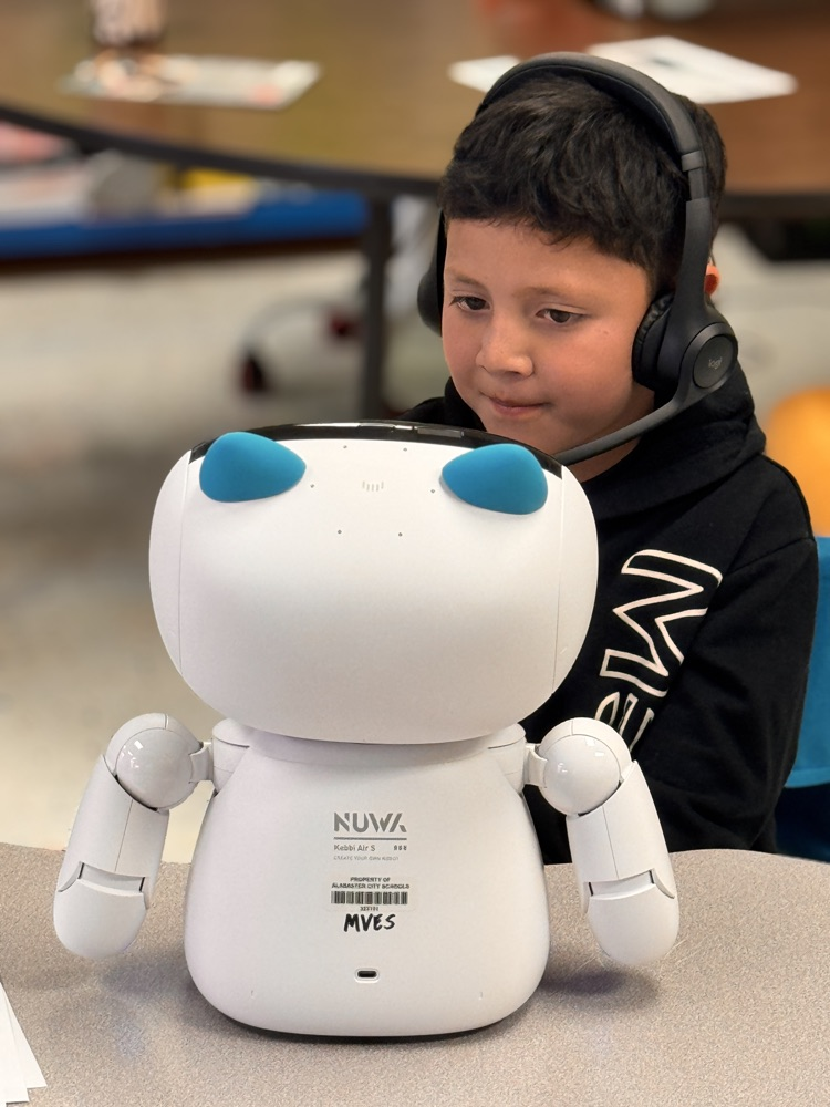 Student talking, and engaging with robot