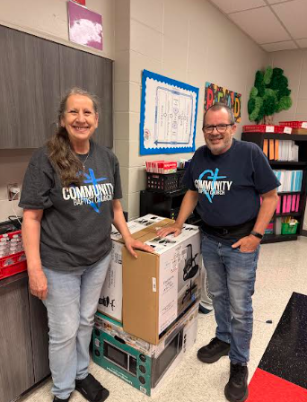 people standing with box