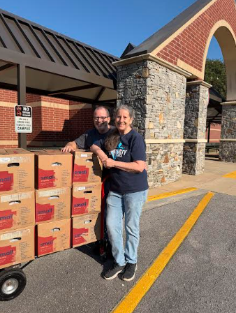 people standing with boxes