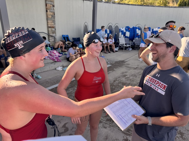 coach and swimmers 