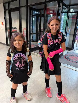 2 girls dressed as rockers