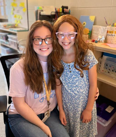 little girl dressed up as teacher
