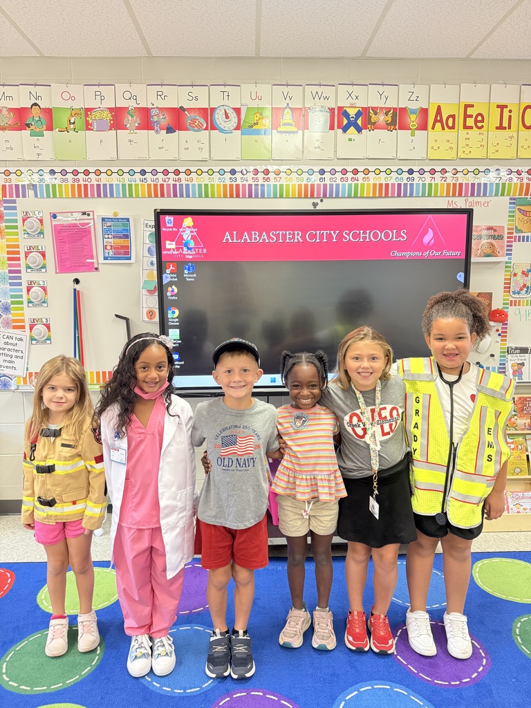 kids dressed up standing in classroom