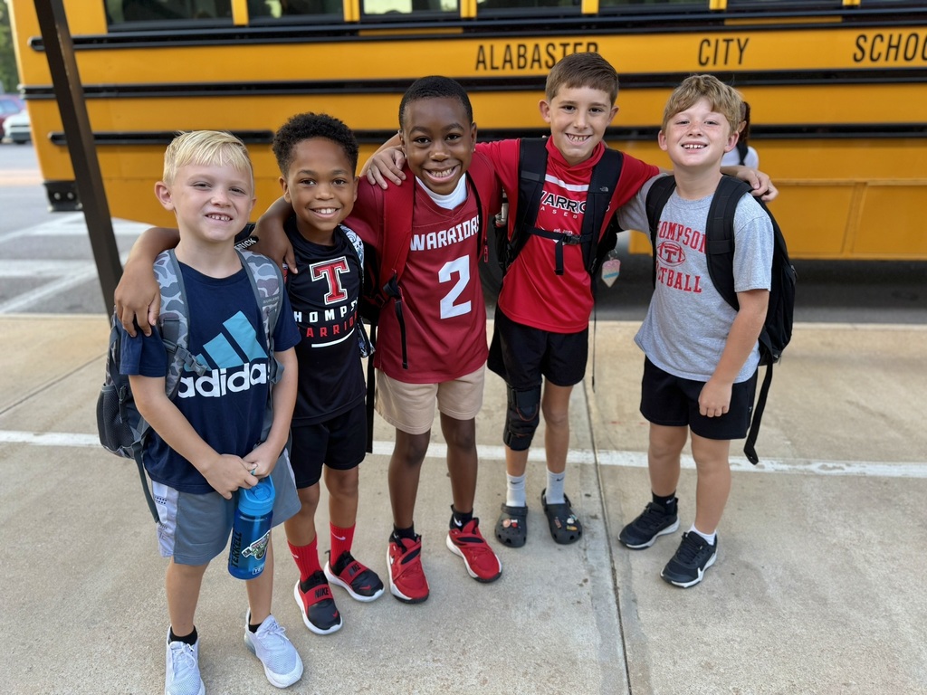 boys in front of bus