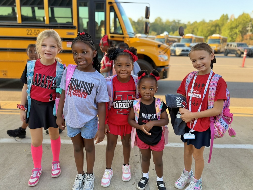 girls in front of bus