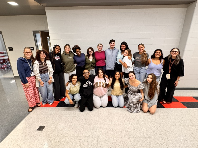 group of students in hallway with two teachers