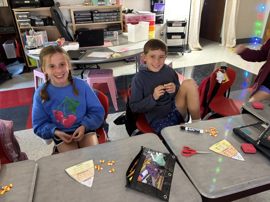 kids doing math on desk with candy corn