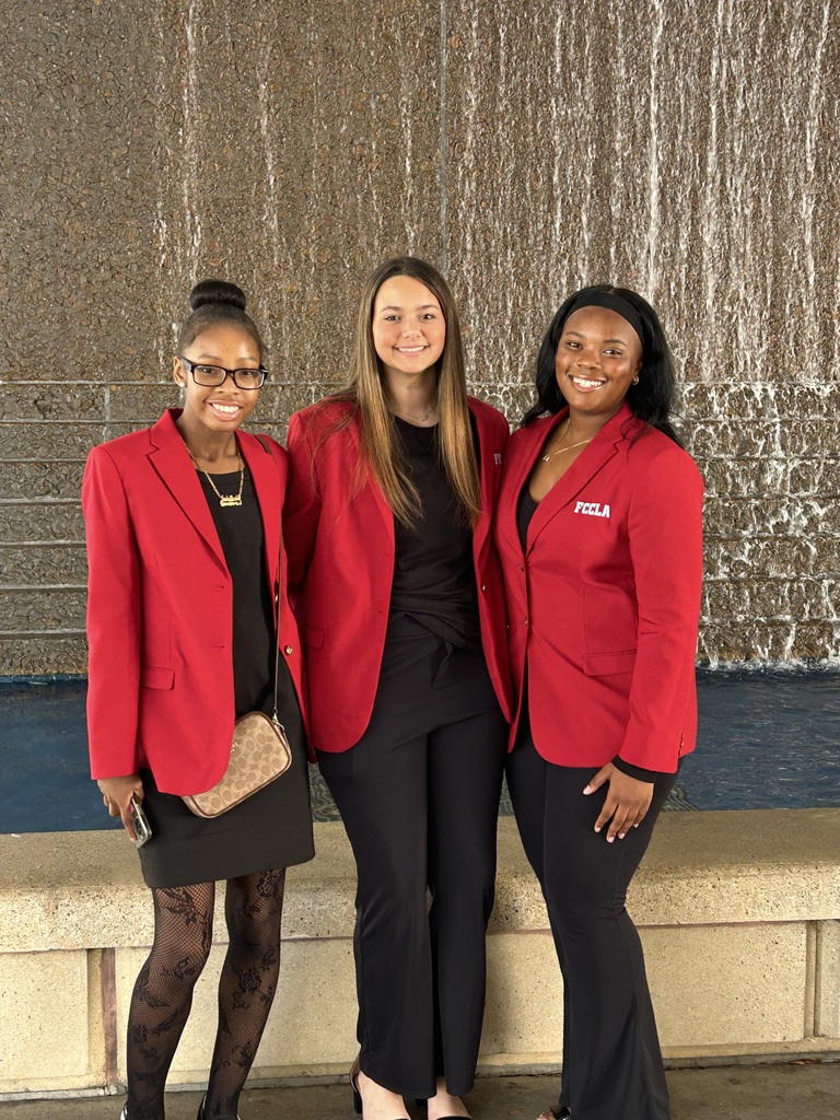 three students in red jackets