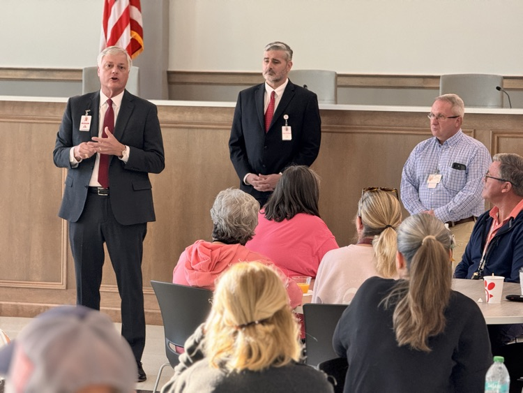 three people speaking