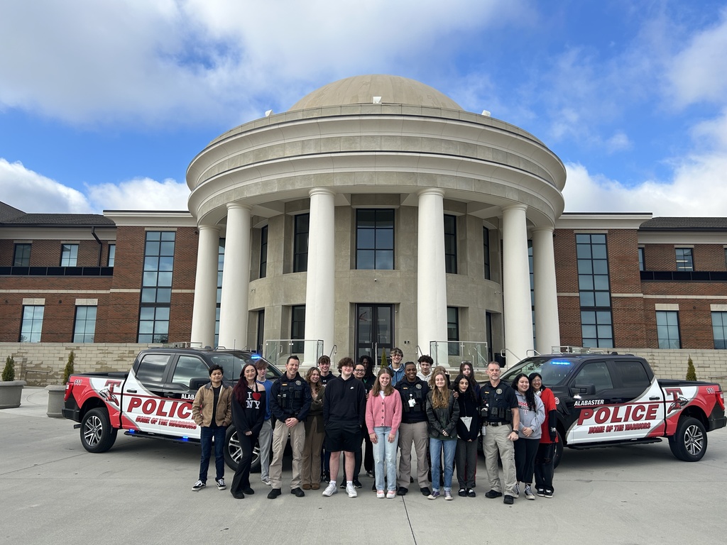 THS SROs and THS students infront of new SRO trucks and THS