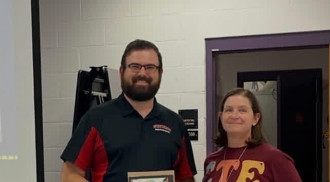 Mr. Wells receiving an award