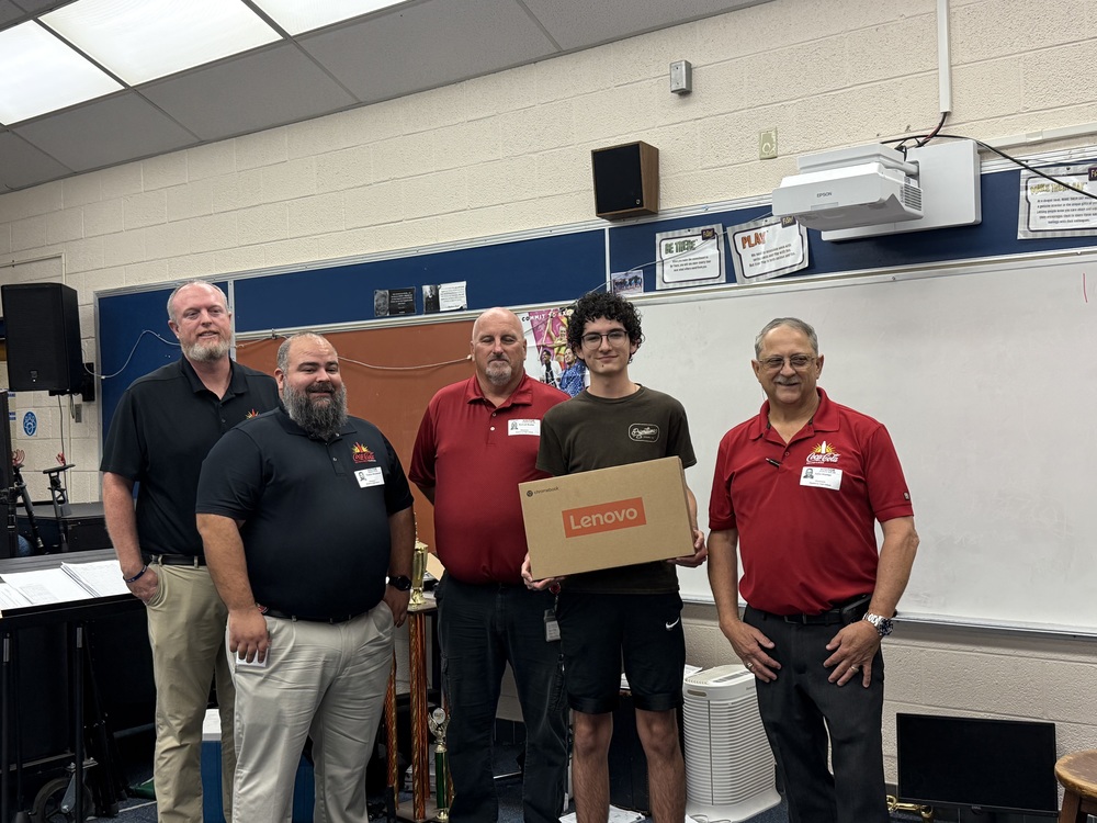 Student receiving laptop
