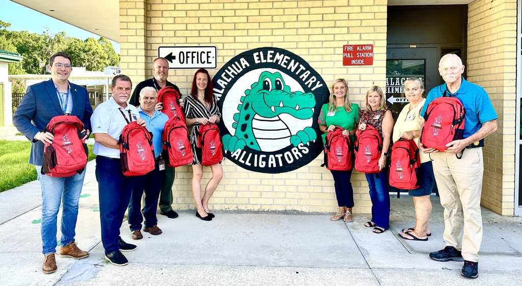 Picture of AES Leadership, Alachua Chamber and Coca-Cola staff with donated supplies. 