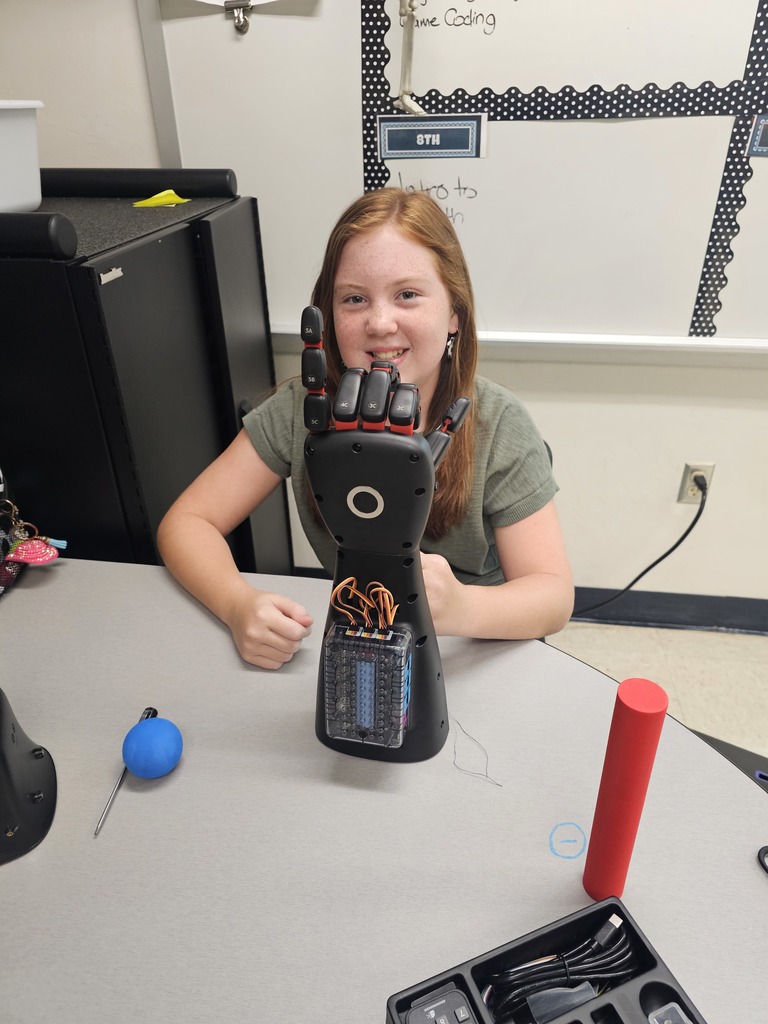 Student showing her working roboitc hand