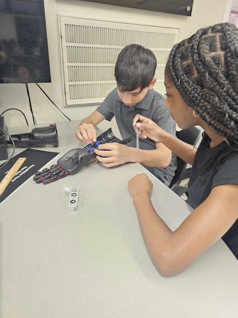 Students working on robotic hand