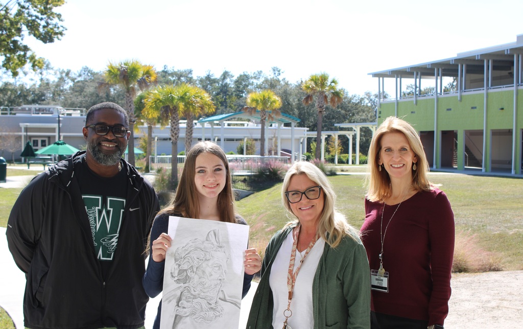  Kinsley poses with her award-winning “Poseidon,” joined by Principal Burney, Mrs. Gattshall, and Mrs. Rollo.