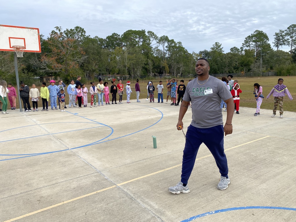 Coach Sam leading stretches
