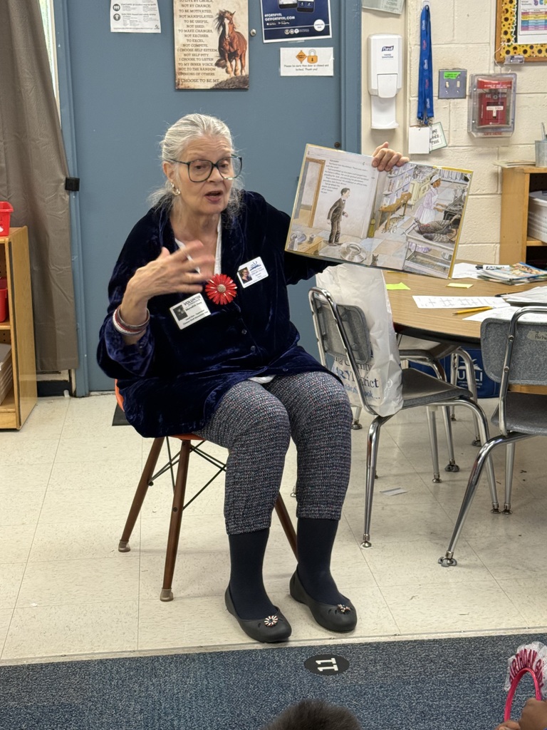 Volunteers reading to students