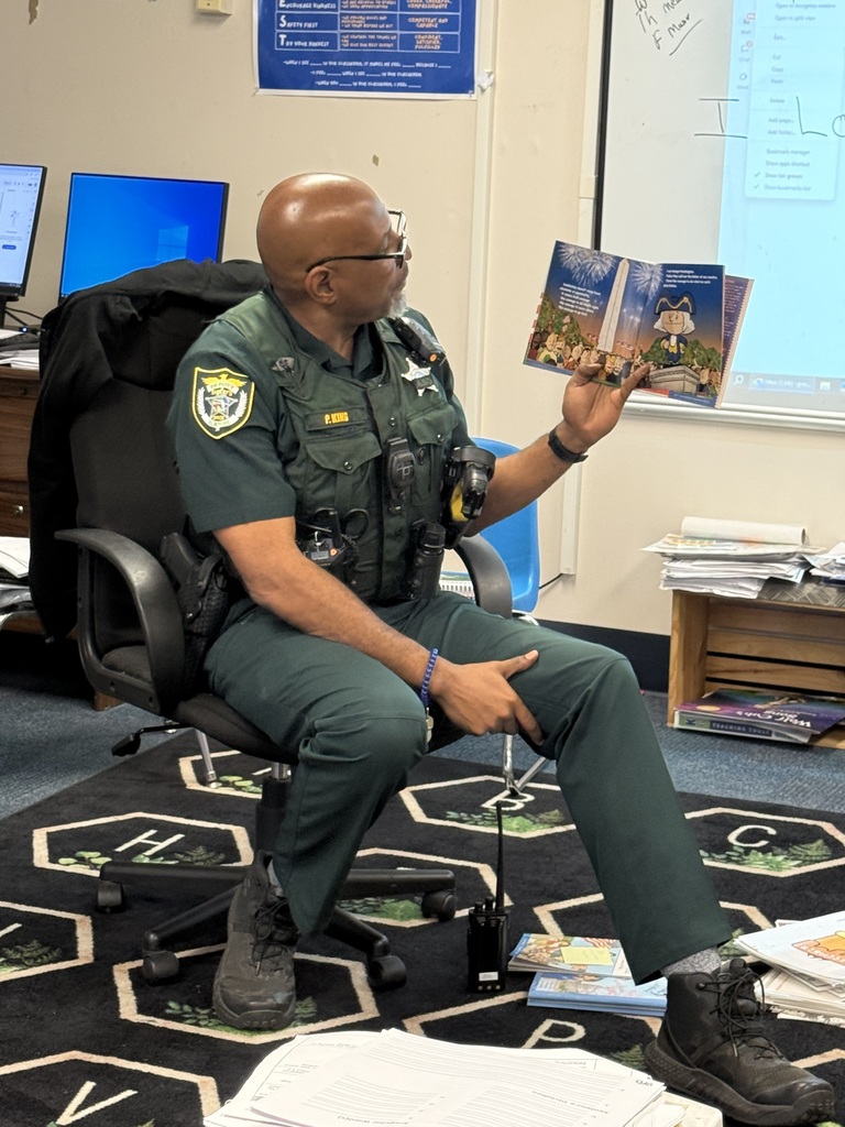 Volunteers reading to students