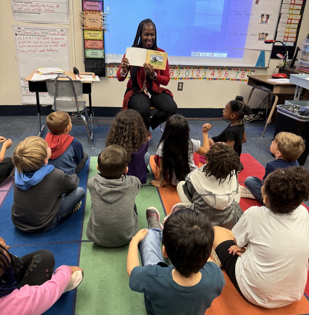 Volunteers reading to students