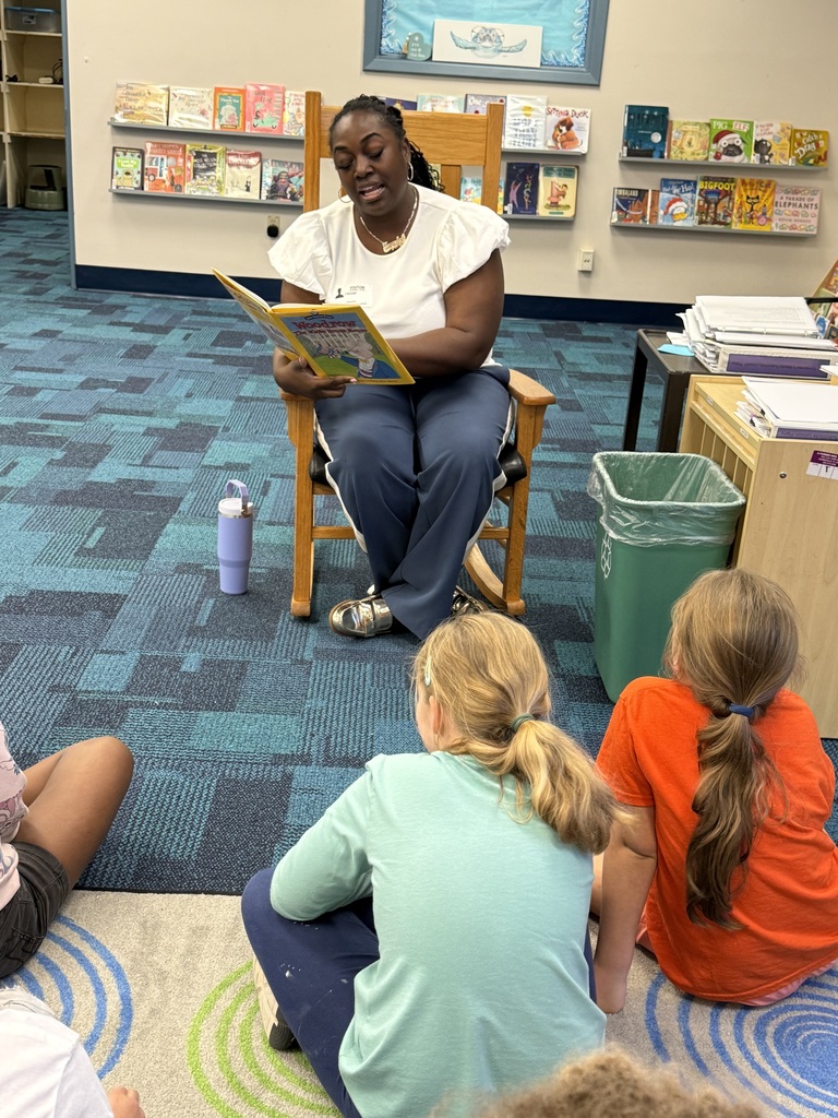Volunteers reading to students
