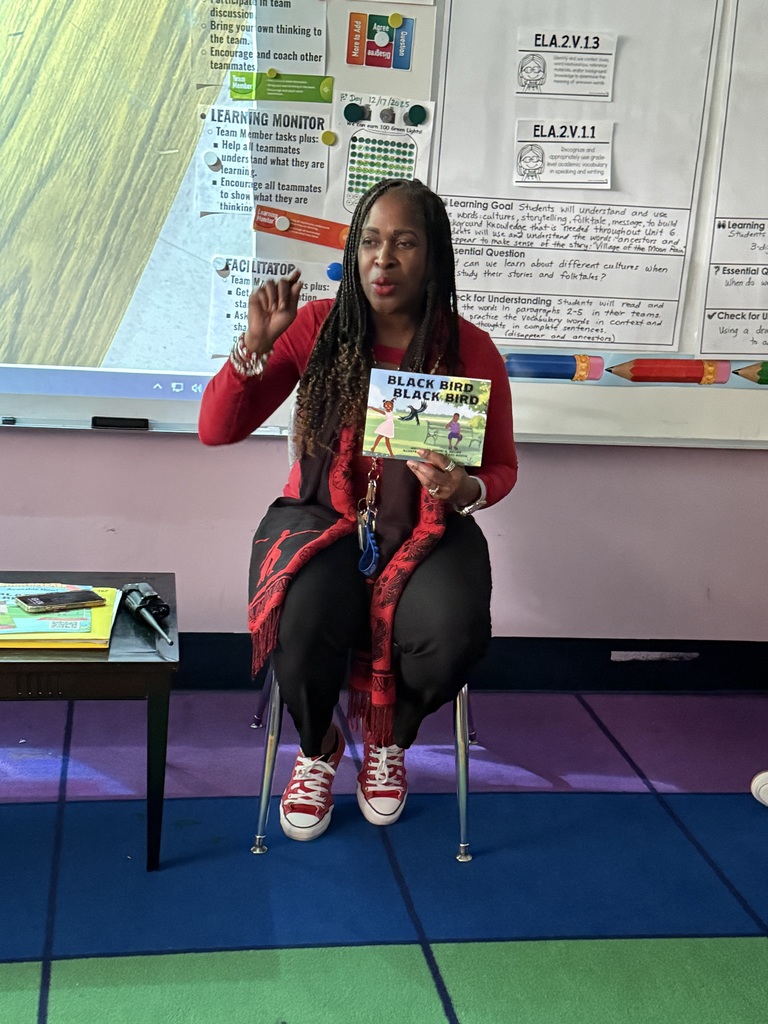 Volunteers reading to students