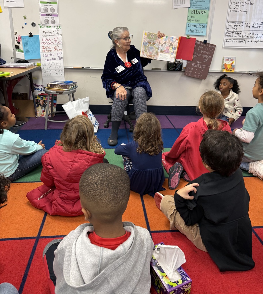 Volunteers reading to students