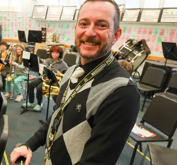 Mr. Loffredo posing for Gainesville Sun picture