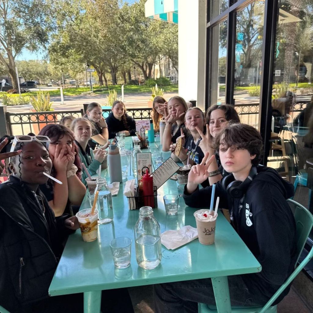 Fueling up in Orlando! 🍽️🎭 Our Jr. Thespians enjoying some downtime together before hitting the stage.