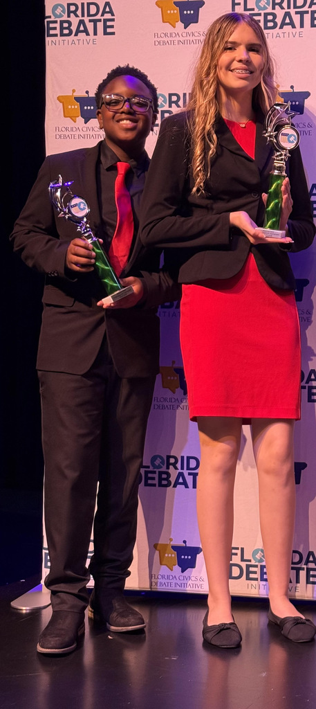 Student with trophy at competition