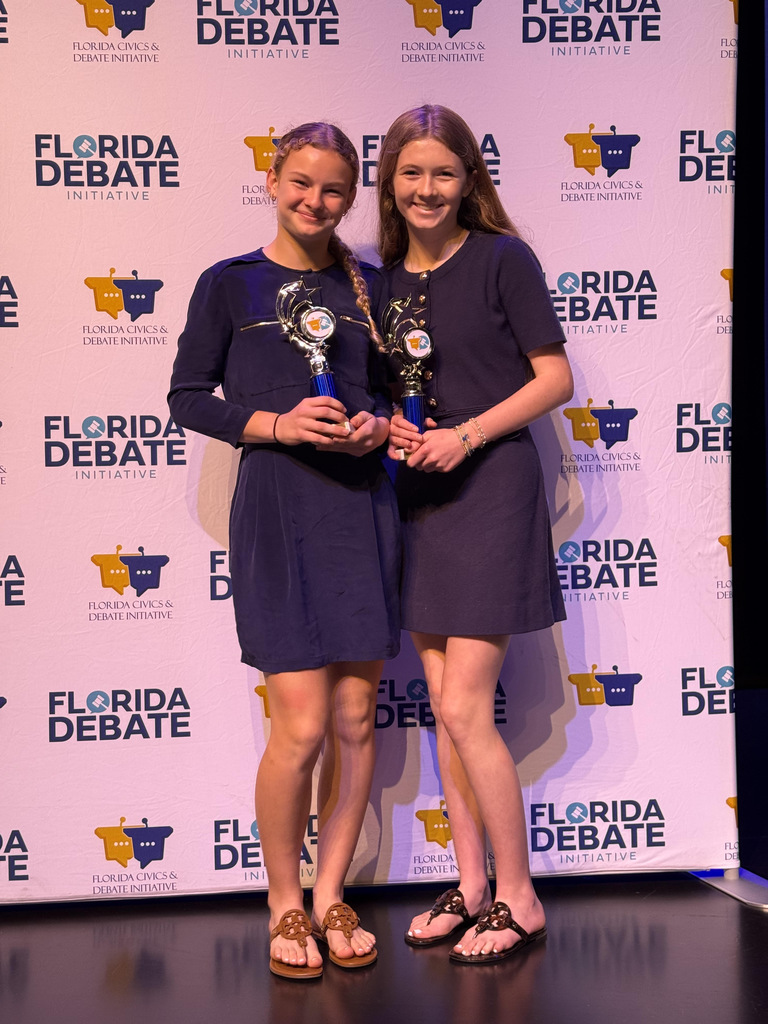 Two Students with trophy at competition
