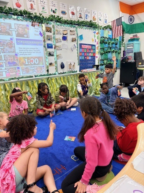large group of students working on the carpet