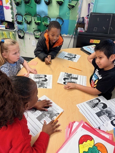 4 students working at a table