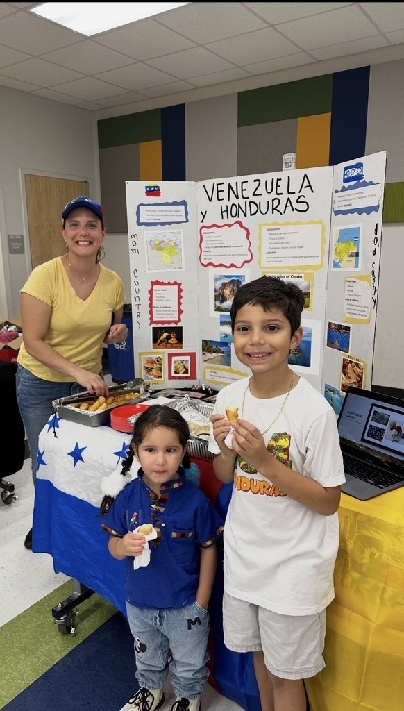 three people in front of display for Venezuela and Honduras