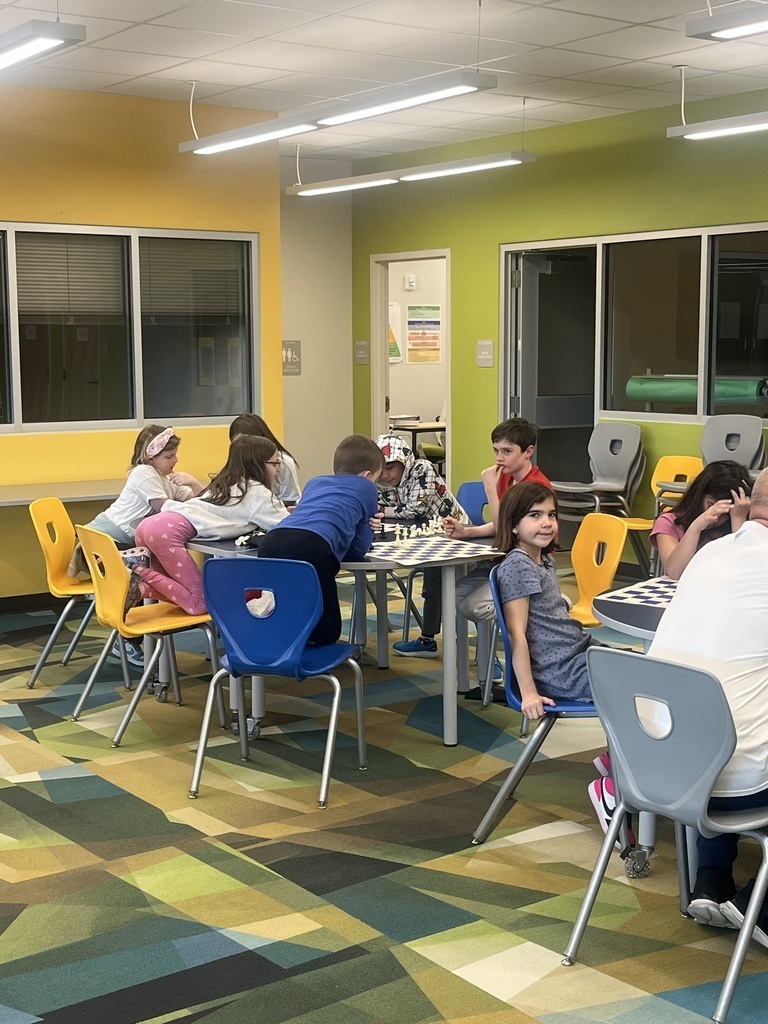 students playing chess at tables