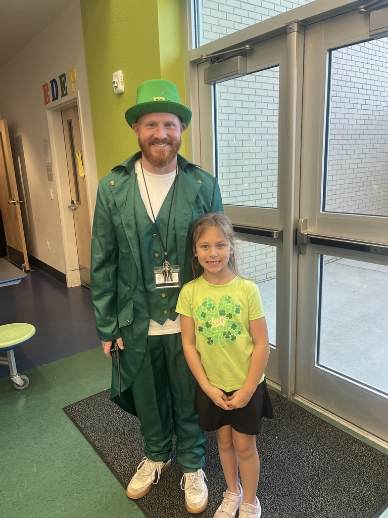 student with Mr. Rutan dressed in a Leprechaun costume