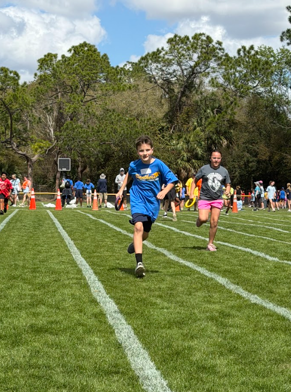 Student relay race at 5th grade field day. 