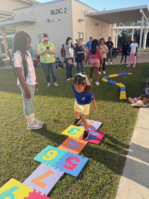 student playing hopscotch