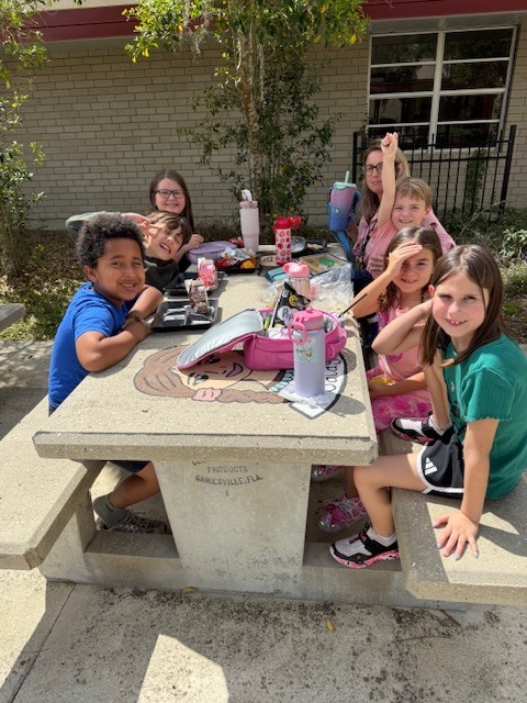 Friday Fun! Ms. Cecere's class enjoyed the sunshine with a picnic lunch bunch while Ms. Rucker's Kindergarten drew sidewalk chalk butterfly predictions based on their Science lesson.