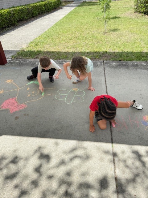 Friday Fun! Ms. Cecere's class enjoyed the sunshine with a picnic lunch bunch while Ms. Rucker's Kindergarten drew sidewalk chalk butterfly predictions based on their Science lesson.
