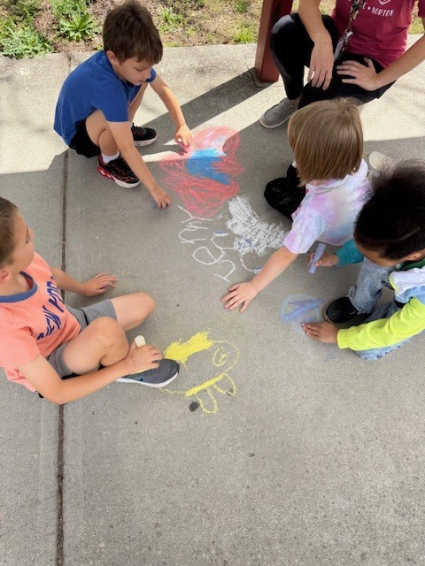 Friday Fun! Ms. Cecere's class enjoyed the sunshine with a picnic lunch bunch while Ms. Rucker's Kindergarten drew sidewalk chalk butterfly predictions based on their Science lesson.