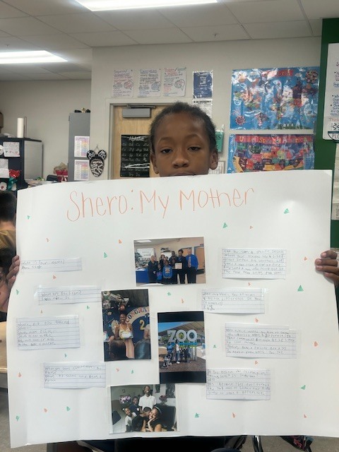 student holding poster project
