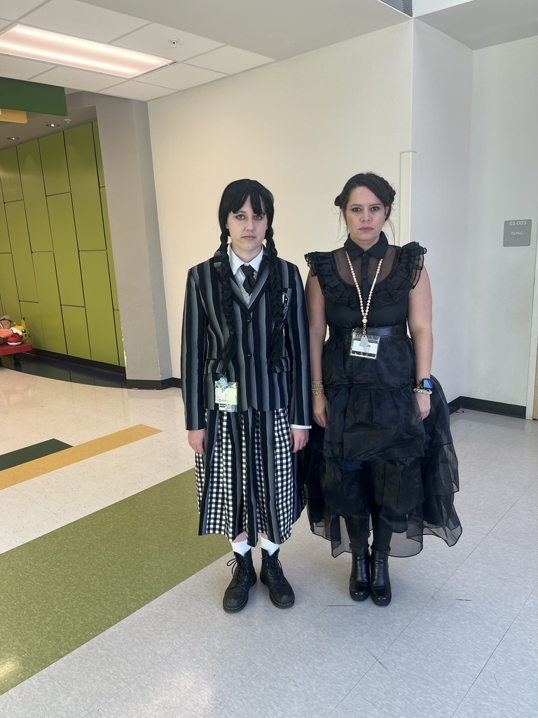 2 women dressed as Wednesday Addams