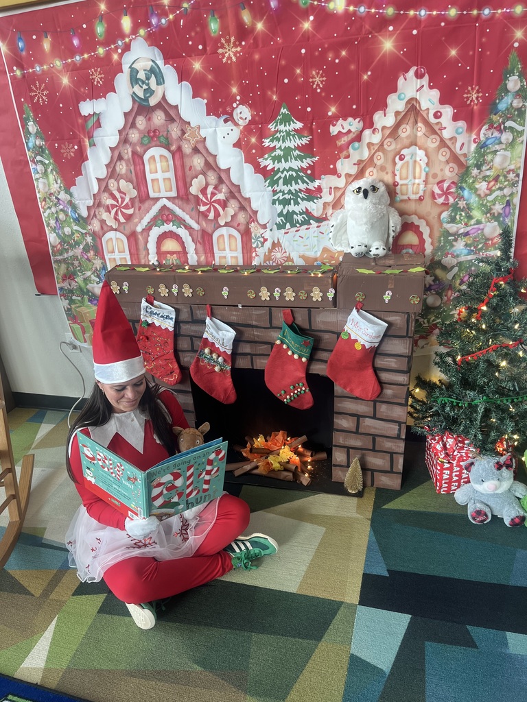 woman dressed as an elf reading a book