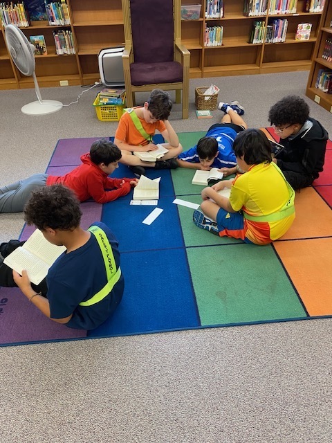 Students groups have a choice of books to read.