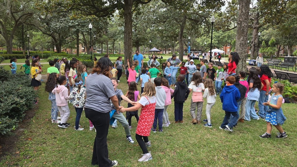 students outside learning salsa dances